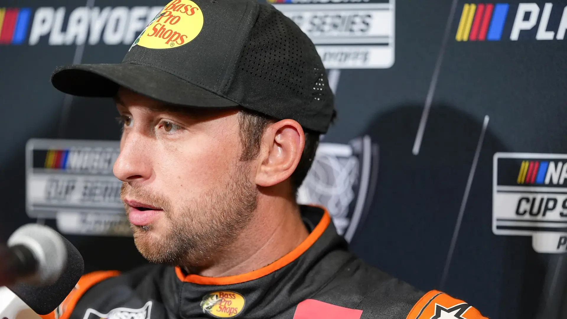 Chase Briscoe sits with a microphone in his face at NASCAR Playoff media day.