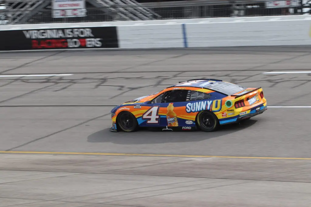 Josh Berry wheels his No. 4 orange and blue Sunny D's Stewart-Haas Racing Ford around the track.