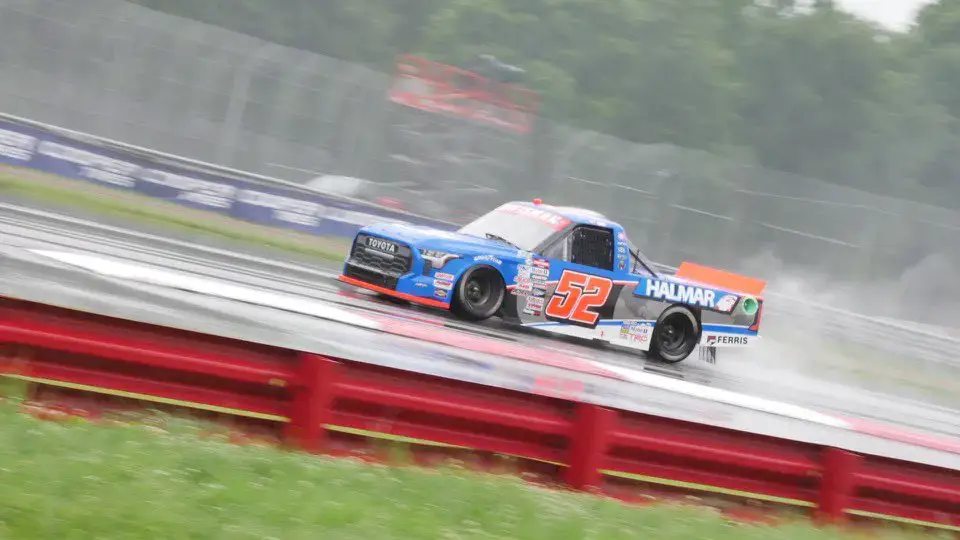 Stewart Friesen's No. 52 blue, white, and gray truck in the rain at Mid-Ohio.