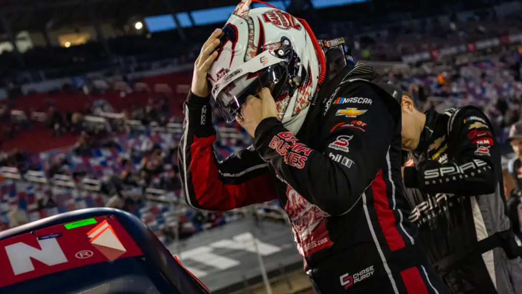Chase Purdy has his white and red helmet on while entering his truck for the race at Martinsville.