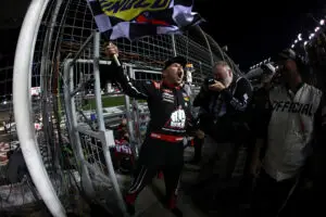 Credit: CONCORD, NORTH CAROLINA - OCTOBER 09: Layne Riggs, driver of the #34 BKB Bare Knuckle Boxing Ford, celebrates with the checkered flag after winning the NASCAR Craftsman Truck Series Ecosave 200 at Charlotte Motor Speedway on October 09, 2026 in Concord, North Carolina. (Photo by Jared C. Tilton/Getty Images)